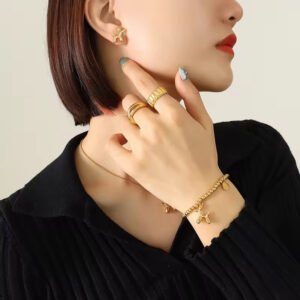 Gold Bead Bracelet with Balloon Poodle Dog and Good Luck Charm